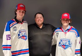 Summerside D. Alex MacDonald Ford Western Capitals general manager Pat McIver, centre, welcomes territorial picks Carson Griffin, left, and Ethan Dickson to the organization. The Caps added six players in the recent Maritime Junior Hockey League (MHL) Entry Draft. Contributed