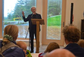 Journalist and author Linden MacIntyre emceed the opening of the new welcome centre at Highland Village on July 19. The intimate crowd of about 20 people listened intently as MacIntyre spoke about a Gaelic society formed in Sydney in the 1970s. NICOLE SULLIVAN / CAPE BRETON POST