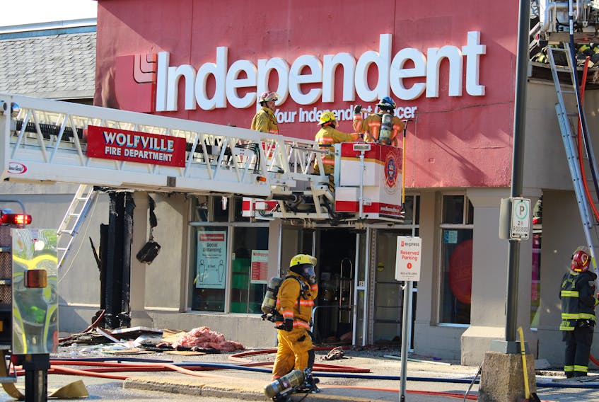 Firefighters fight a structure fire July 1 at Jason’s Your Independent Grocer in downtown Kentville.