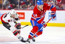 Montreal Canadiens centre Nick Suzuki skates away from Ottawa Senators' Connor Brown during first period in Montreal on April 5, 2022. 