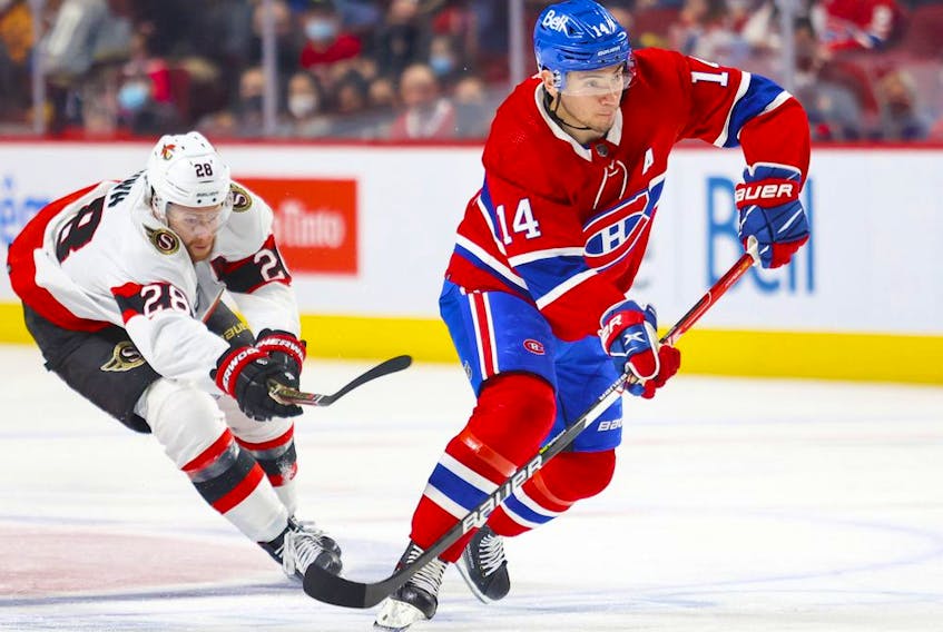 Montreal Canadiens centre Nick Suzuki skates away from Ottawa Senators' Connor Brown during first period in Montreal on April 5, 2022. 