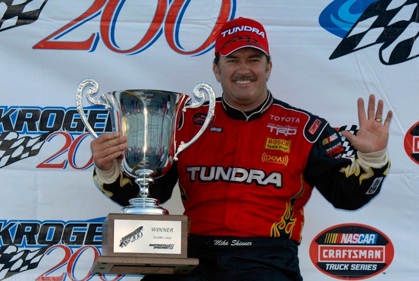 Former NASCAR driver Mike Skinner, shown after a win on the Camping World Truck Series, will race in Saturday's IWK 250 at Riverside Speedway in James River.