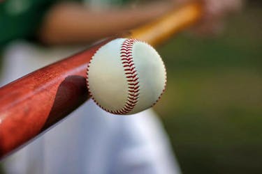 a baseball player hitting a ball  The Nova Scotia Major Little League Provincial Championship will continue this weekend at Cameron Bowl in Glace Bay. The host Glace Bay McDonald’s Colonels enter the weekend undefeated. STOCK IMAGE.