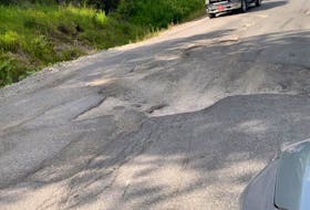 A closer look at the pothole in the road near St. Pat’s Church in Woody Point. Residents fear there will be a bad accident there if the road is not fixed soon. - Contributed