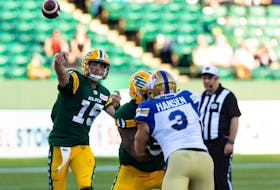 Edmonton Elks' quarterback Taylor Cornelius (15) throws the ball against the Winnipeg Blue Bombers during first half CFL football action at Commonwealth Stadium in Edmonton on Friday, July 22, 2022. 