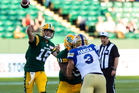 Edmonton Elks' quarterback Taylor Cornelius (15) throws the ball against the Winnipeg Blue Bombers during first half CFL football action at Commonwealth Stadium in Edmonton on Friday, July 22, 2022. 