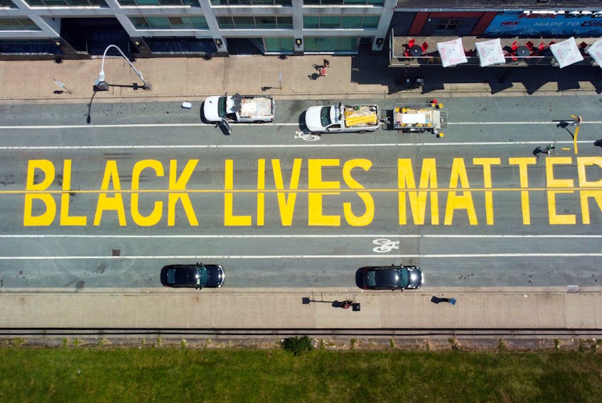 July 24, 2022--Crews finish painting a "Black Lives Matter on Brunswick Street in Halifax, between Carmichael and Prince Streets Sunday.
ERIC WYNNE/Chronicle Herald