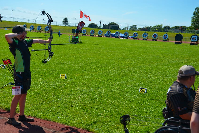Team P.E.I.’s Keegan Crawford takes aim during the target competition at the 2022 Canadian outdoor archery championships at UPEI. Crawford won a gold medal on July 23. Jason Simmonds • The Guardian