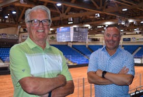 John Abbott, left, chair of the Charlottetown Civic Centre Management Inc. board of directors, and Wayne Long, a member of the board, say the City of Charlottetown will spend up to $400,000 on a new centre ice digital scoreboard that will be able to show replays. Dave Stewart • The Guardian