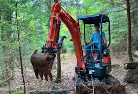 Town of Truro employee Jack Morrison operates a Kubota U17 mini-excavator that was recently donated to The Railyard Mountain Bike Park to help further trail building.