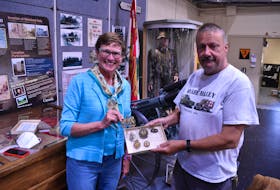Eleanore Pabarue, left, and Greg Gallant are happy to have Pabarue's grandfather's memorabilia returned to P.E.I. and added to the collection at the P.E.I. Regiment Museum July 20. Alison Jenkins • The Guardian