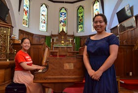Carmen and Chantal Peng of Wolfville, seen here at St. James Anglican Church in Kentville, are sisters who share a passion for music. Both have performed as pianists at New York’s iconic Carnegie Hall. KIRK STARRATT