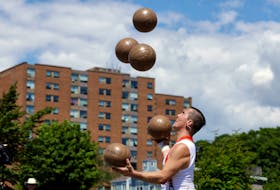 July 28, 2022--Performer Victor Rubilar juggles five balls to close out his set at one of the stages at Alderney Landing Thursday. The festival, which was on hiatus for the last two years, is back. It runs until Monday, August 1. Performances stages are located along the Halifax Waterfront, and Alderney Landing.
ERIC WYNNE/Chronicle Herald