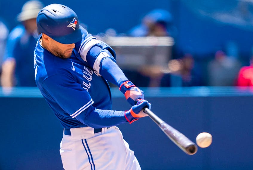 Toronto Blue Jays centre fielder George Springer hits a double against the Tampa Bay Rays at Rogers Centre. 