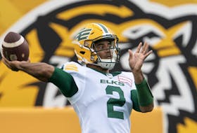Edmonton Elks quarterback Tre Ford (2) throws during warm up prior to a game against the Hamilton Tiger-Cats in Hamilton, Ont., on Friday, July 1, 2022.