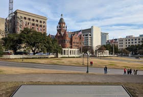 A view from the formerly named Texas School Book Depository in the direction where the president was assassinated. – Mike Morrison