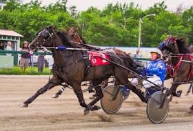 A Better Man (No.1) and driver Gerard Kennedy, withstood late challenges from Mando Fun, far left and Gentry Seelster, inside right, to win the Saturday afternoon feature in 1:57.4 at Northside Downs. CONTRIBUTED/TANYA ROMEO
