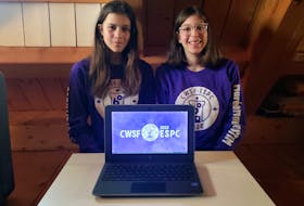 From left, 17-year-old Nila Munro and her 13-year-old sister Elise Munro in their West Mabou home. Both sisters were chosen to compete in the national Canada-Wide Science Fair in May. CONTRIBUTED