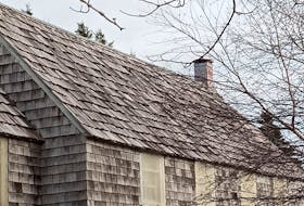 A look at the shingles before work began. American Bradley Jacob Folensbee Jr. was the last person to replace them, in the early 1980s, with imported western red cedar shingles. Measuring two-and-a-half inches thick at one end, it made finding similar shingles for the replacement a challenge. - Rex Passion photo