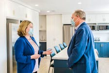 Health and Wellness Minister Ernie Hudson touring the new addictions extended care facility with Charmaine Campbell, Health P.E.I.’s manager of mental health and addictions transitional services.