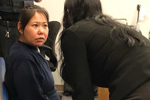 Accused murderer Lorraine Obed, 29, speaks with defence lawyer Sarah Evans in provincial court in St. John's on Monday, July 4, at the start of her preliminary inquiry.