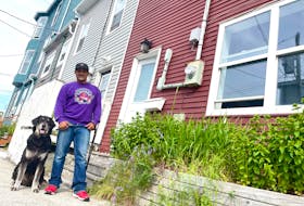 Tremaine Clarke, pictured with his dog Buddy, was all smiles on Monday, July 4, because he found an apartment after six weeks of living in a tent in Pippy Park in St. John's. -Juanita Mercer/SaltWire Network
