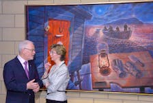 Artist David Blackwood speaks with Janet Peddigrew, vice-president of the Bank of Montreal for Newfoundland and Labrador, during the unveiling of a new painting by Blackwood called Home From Bragg's Island. The painting was presented to the province by the Bank of Montreal in 2009 in honour of the province's 60th anniversary in confederation. Keith Gosse/The Telegram