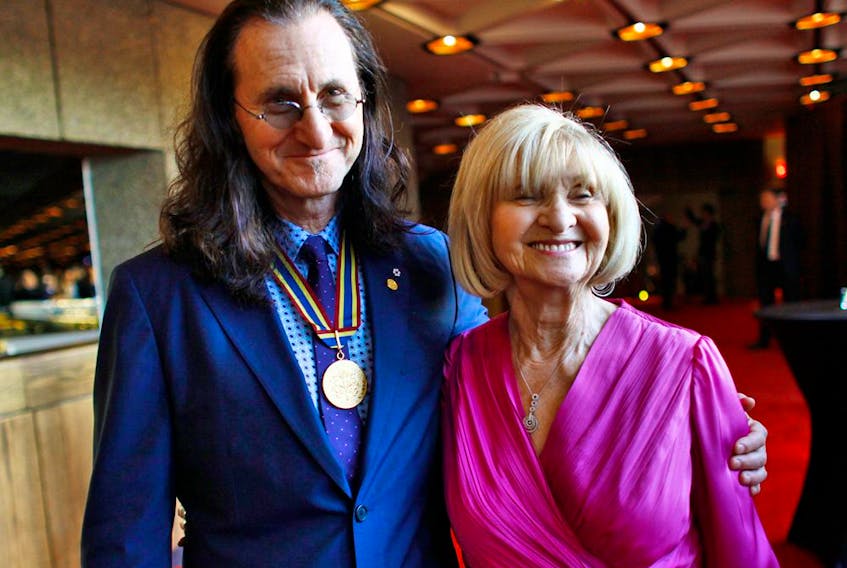 Rush singer Geddy Lee says his mother Mary Weinrib, seen here with him in 2012, was open about her experience in concentration camps in Germany. New software has identified photos of Weinrib, who died in 2021, in one camp.