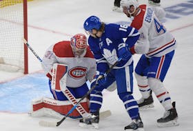Montreal Canadiens goalie Carey Price makes a save as defenceman Joel Edmundson covers Toronto Maple Leafs forward Mitch Marner in Game 7 of the first round of the 2021 Stanley Cup playoffs. 