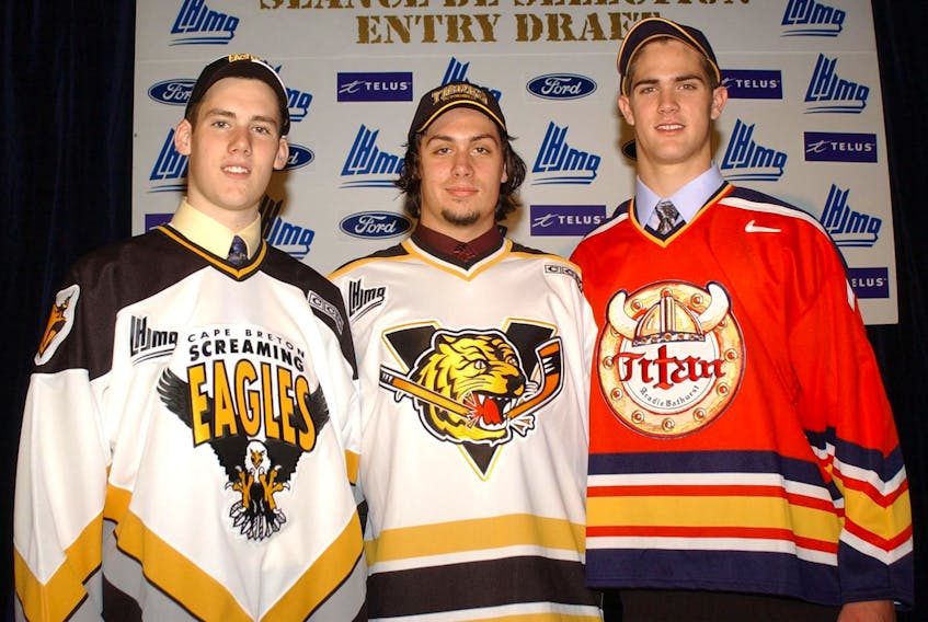 James Sheppard, left, stands with Jason Legault, and Alex Lamontagne following the opening round of the 2004 Quebec Major Junior Hockey League Entry Draft in Baie-Comeau, Que. Sheppard was taken first overall by Cape Breton, while Lamontagne was selected second overall by the Acadie-Bathurst Titan, and Legault was chosen third overall by the Victoriaville Tigres. CONTRIBUTED/FILE PHOTO.