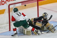 Halifax Mooseheads Jordan Dumais scores against Charlottetown Islanders goalie Francesco Lapenna after picking off a pass and taking it in on a breakaway, during QMJHL action in Ha;ifax Saturday April 2, 2022.

TIM KROCHAK PHOTO