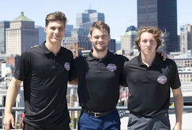 Potential top picks for the coming NHL draft, stand in front of the city's skyline on Wednesday July 6, 2022. Juraj Slafkovsky, from left, Shane Wright, Logan Cooley.