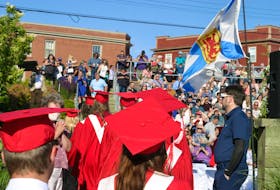 Members of the Annapolis West Education Centre graduating class enter the Oqwa’titek Amphitheatre in Annapolis Royal on June 22.