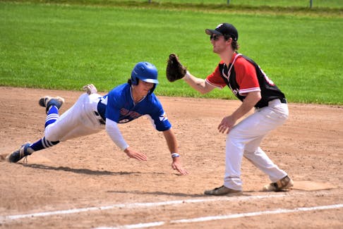 Truro’s Carter Higgins dives back into first base during Sunday afternoon action at Albion Field in Stellarton. Higgins and his U-17 Team Nova Scotia teammates took on the Pictou County U-22 AAA squad, as part of the Bluenose League and their Canada Games preparation. Richard MacKenzie