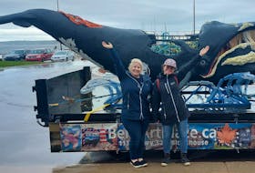 Elizabeth Wile, left, and Eveline Hipson pose with their flagship whale calf sculpture that headlines Project SculptShore, an awareness initiative to teach Nova Scotians and Prince Edward Islanders about the North Atlantic right whale. CONTRIBUTED