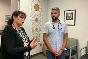 Pam Glode-Desrochers, executive director of the Mi'kmaq Native Frienship Centre, and Dr. Brent Young, the clinical lead for the Urban Indigenous Wellness Initiative with MNFC, speak during a media tour of the new Wije’winen Health Centre on Thursday. - John McPhee