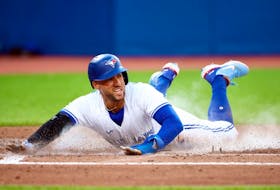 George Springer of the Toronto Blue Jays scores a run on a RBI single by Alejandro Kirk in the third inning against the Detroit Tigers at Rogers Centre on July 28, 2022 in Toronto, Ontario, Canada.