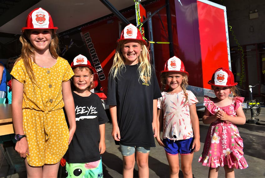 Ivy Ellis (left), Eli Ellis, Millie Medaglia, Poppy Medaglia, and Lennon Dickie enjoying some of the fun activities available for youth during the Brookfield Fire and Emergency Services open house. Richard MacKenzie