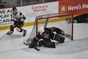 Merle Putnam, then a member of the Pictou County Weeks Crushers, rounds the Truro Bearcats’ net during Maritime Hockey League action in March 2022. The 19-year-old forward was traded to the Bearcats on July 25.