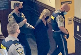 Former IWK Health Centre CEO Tracy Kitch is escorted out of Halifax provincial court Wednesday after being sentenced to five months in jail and a year’s probation for defrauding the Halifax hospital of more than $43,000.