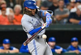 Toronto Blue Jays shortstop Bo Bichette hits a three-run home run against the Baltimore Orioles at Oriole Park at Camden Yards. 