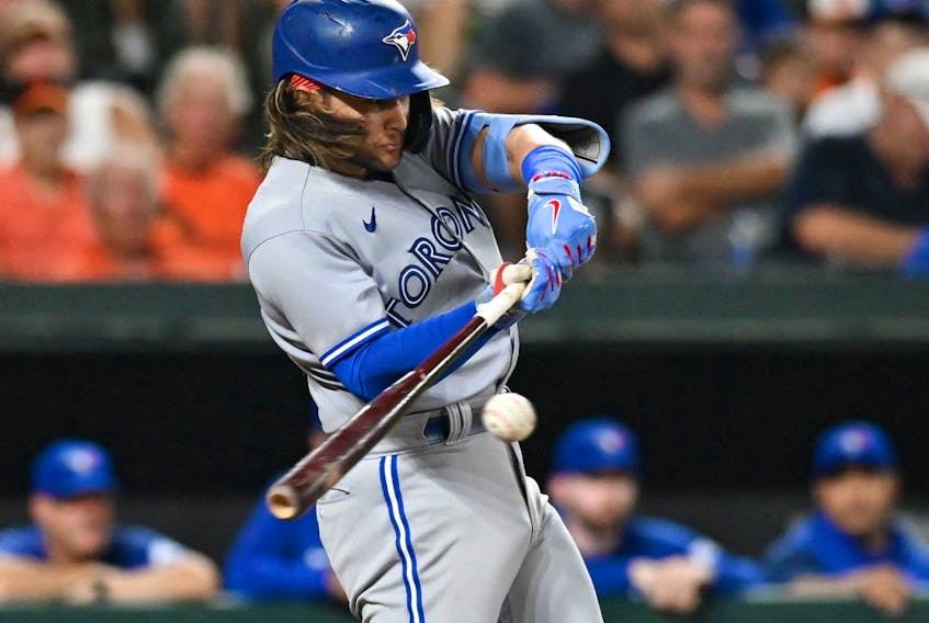 Toronto Blue Jays shortstop Bo Bichette hits a three-run home run against the Baltimore Orioles at Oriole Park at Camden Yards. 