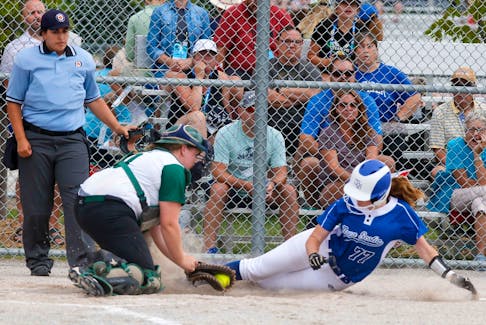 Jayden Palmer, MacLellan's Brook, slides home during the Women's Softball game at Southward Community Park, Grimsby, ON. Palmer was out on the play. Communications Nova Scotia/ Len Wagg