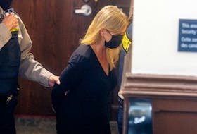 Former IWK Health Centre CEO Tracy Kitch is escorted out of Halifax provincial court by sheriff's deputies Wednesday after she was sentenced to five months in jail and a year’s probation for defrauding the Halifax hospital of more than $43,000.