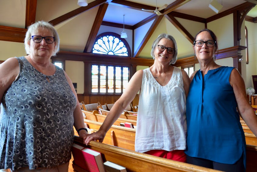 First Cornwallis Baptist Church anniversary committee secretary Bessie Crouse, chairperson Dianne Rafuse-Bennett and member Debbie Reimer, pictured in the church sanctuary, are hard at work planning a celebration for later this month. KIRK STARRATT