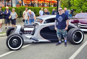Mark Beaulieu with his radically customized 1932 Ford coupe at 2022 Northwest Deuce Days in Victoria, B.C. Beaulieu aimed to finish working on the car not just for this event, but also for his wedding on Aug. 6. Alyn Edwards photo