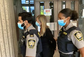 Former IWK Health Centre chief executive officer Tracy Kitch is led out of the Nova Scotia Court of Appeal on Thursday after being granted bail pending an appeal of her conviction and five-month jail sentence for defrauding the Halifax hospital.