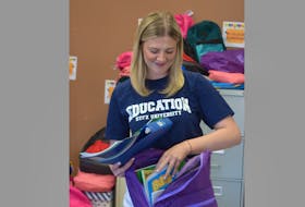 Abby Bugden packages some school supplies that will be given to students in Pictou County thanks to a United Way of Pictou County program.
