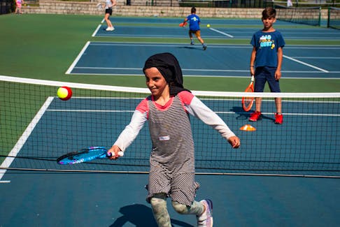 Kawsar Ahmady and her brother Yasir play tennis at the Halifax Common courts as part of the New 2 TNS program on Friday, April 5, 2022. The program, which is for kids age 6-17, aims to introduce immigrants to tennis.
Ryan Taplin - The Chronicle Herald