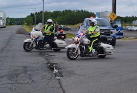 RCMP and Halifax Regional Police officers provided traffic control and escort for the Law Enforcement Torch Run through the county. Ray Burns – The News